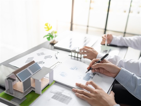 small scale models and plans on a table