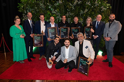 Winners of the 2023 Sustainable Business Awards displaying their awards