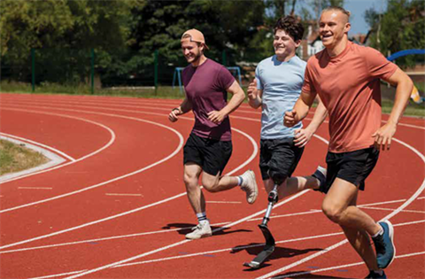 Three men running on an athletics track.