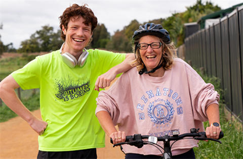 A runner and cyclist on the Longbeach Trail