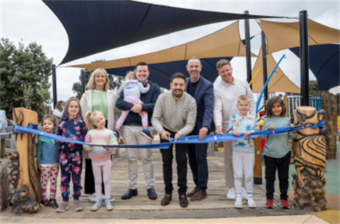 Cutting the ribbon at the Peter Scullin Playground opening.