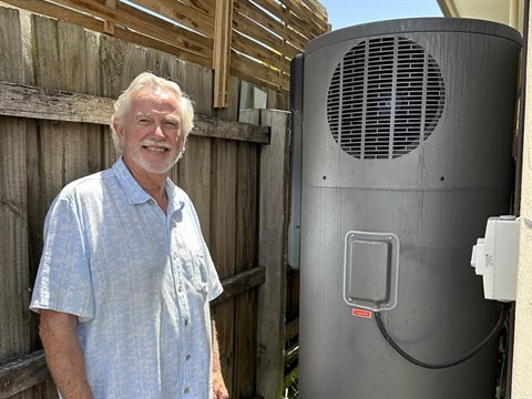 Parkdale homeowner Michael with his new electrically powered heat pump hot water system.