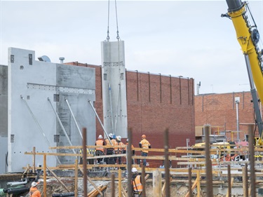 Precast concrete panels craned into place