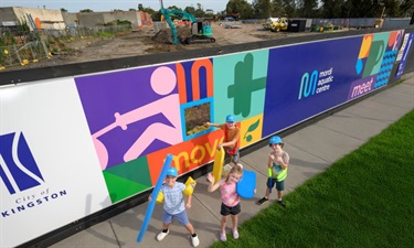 Behind the colourful hoarding on Governor Rd works are well underway on the new Mordi Aquatic Centre.