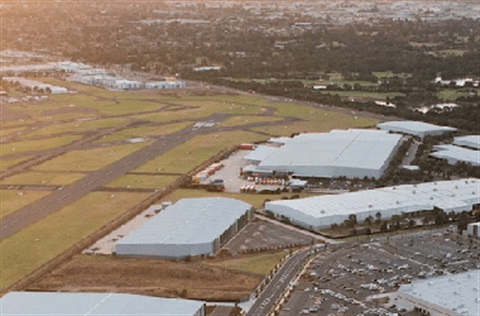 Aerial view of runway and buildings at Moorabbin Airport.
