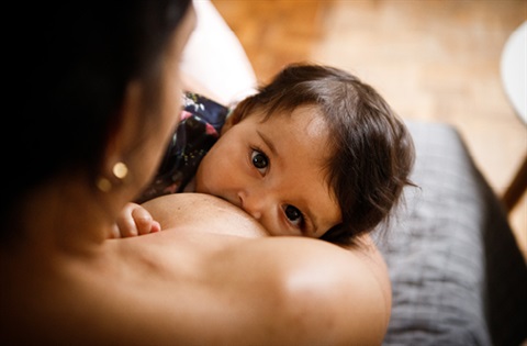 A baby breastfeeding.