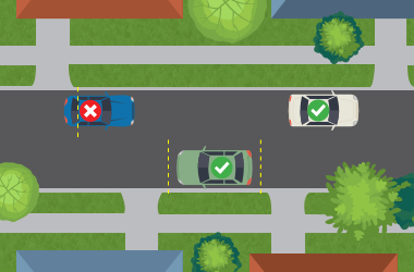 Illustration of vehicles parked illegally and legally near a driveway